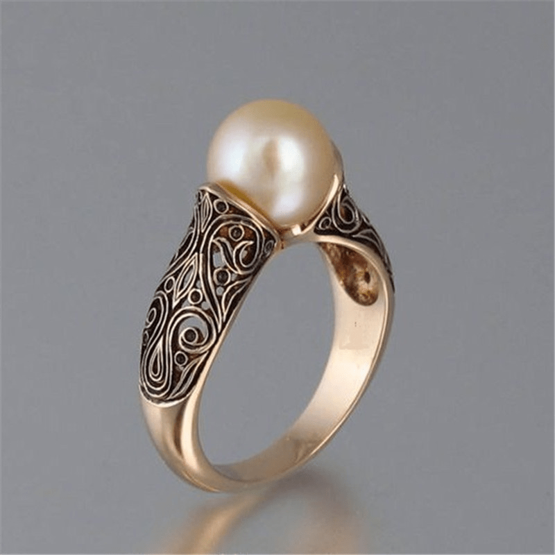 Bague vintage en perles dorées